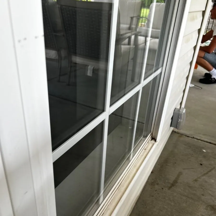 The same sliding door with clear glass and a wiped sill after cleaning, O'Fallon